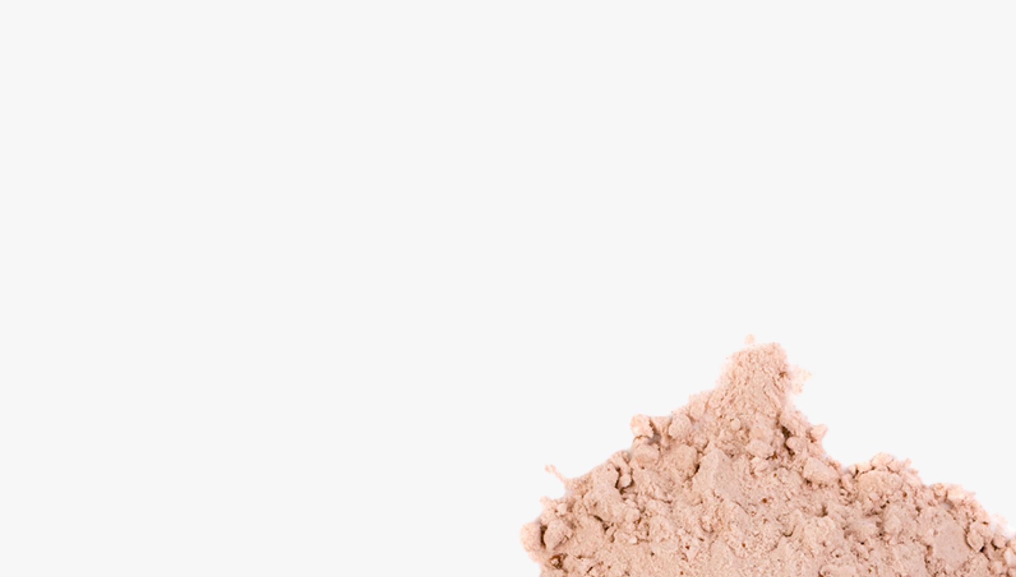 A scoop of Soylent powder on a pale background