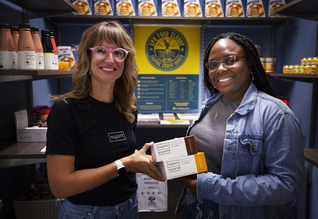 Soylent team member donating a few cases of products to a local food bank